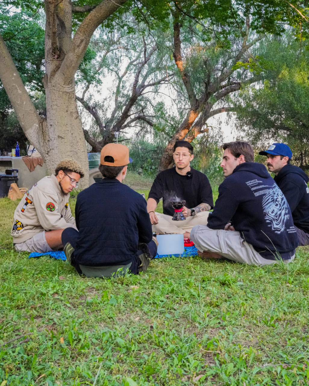 Tristan leading a seated outdoor circle