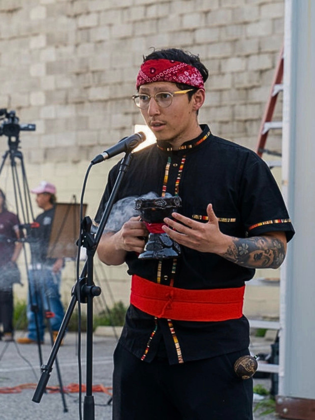 Tristan leading an outdoor opening ceremony