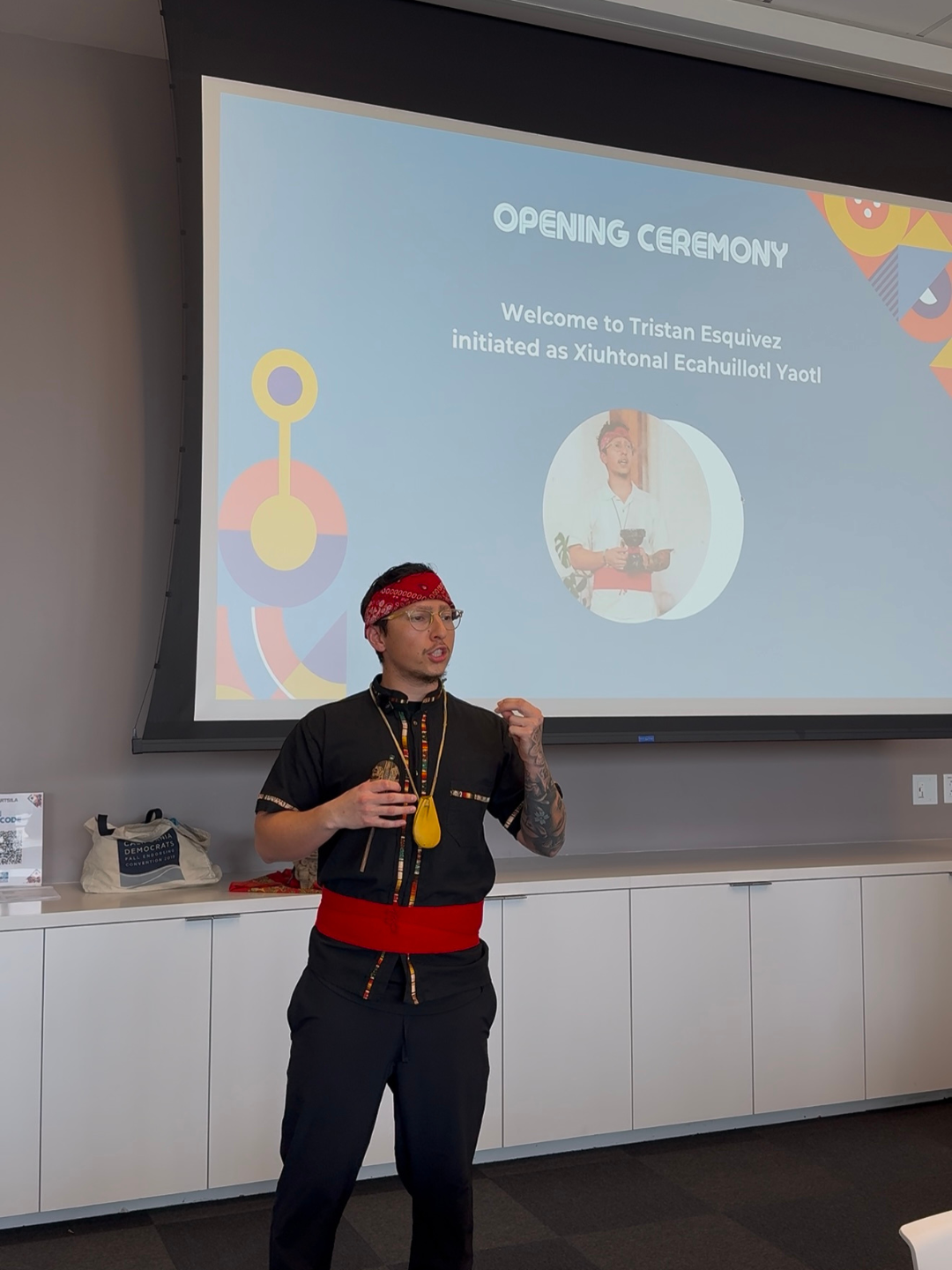Tristan addressing guests at a conference opening